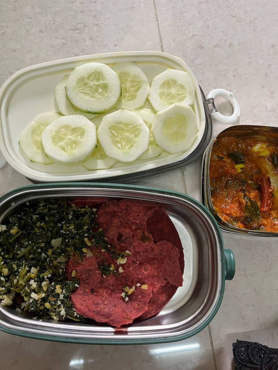 Beetroot chapatis with a greens and moong dal poriyal, cucumber and a side curry, from one of the couple's dinners