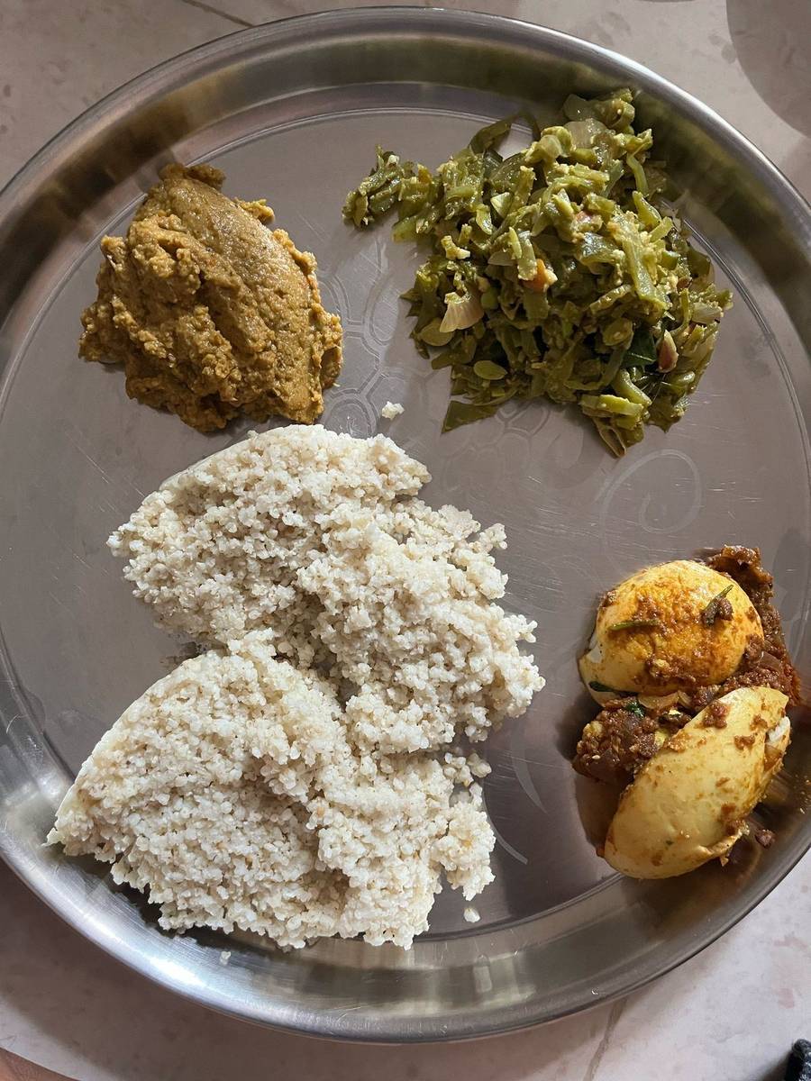 A millet-based lunch from Banu and Deepak's plan: little millet in place of white rice, a green beans poriyal, egg masala and a chutney