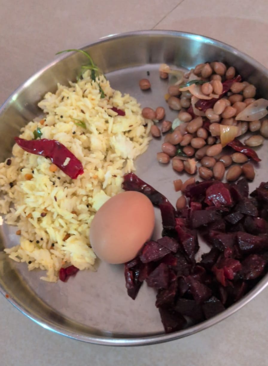 Another meal from Shalini's plan: lemon rice with a boiled egg, beetroot poriyal, and peanut sundal
